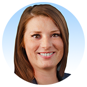 Danielle Dryden, Senior Tax Attorney and Certified Tax Resolution Specialist at Tax Problem Solver, smiling portrait with a blue background, representing expertise in tax resolution and client-centered advocacy.
